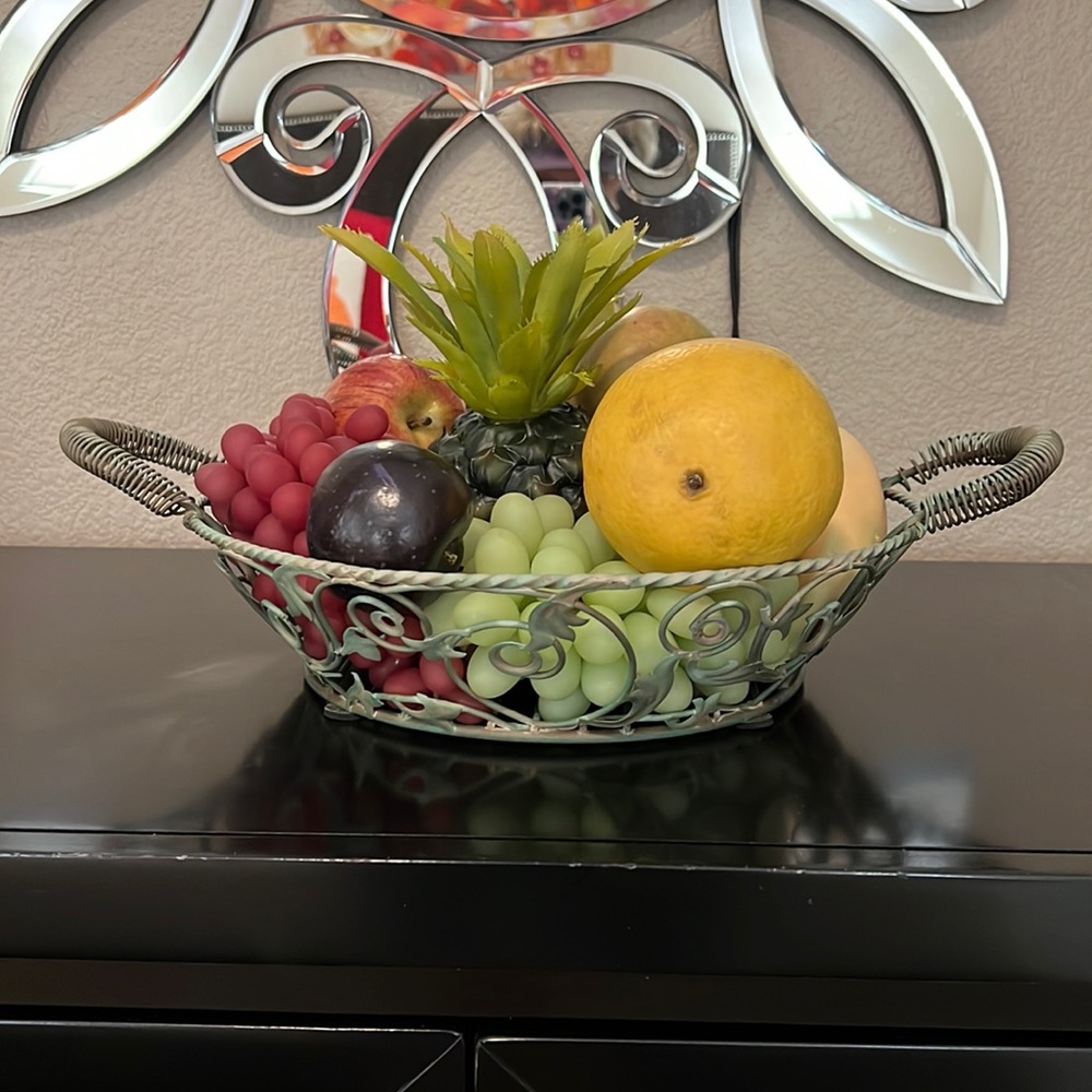 “ Petina”  finished rod iron basket with faux fruit. Great for a kitchen table.